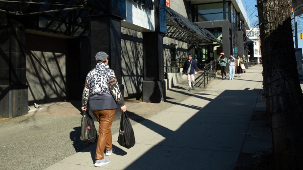 A shopper outside a Safeway store in the Kitsilano neighborhood of Vancouver, British Columbia, Canada, on Tuesday, March 19, 2024. Photographer: Isabella Falsetti/Bloomberg