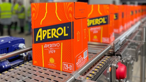 Aperol bottles in line to be labeled and dispatched.