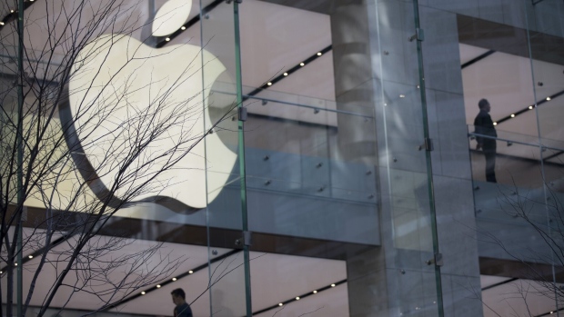 An illuminated Apple Inc. logo on its store in Sydney, Australia, on Sunday, Sept. 3, 2023. Australia is scheduled to release its second-quarter gross domestic product (GDP) figures on Sept. 6. Photographer: Brent Lewin/Bloomberg