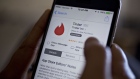 The Tinder application is displayed in the Apple Inc. App Store on an iPhone in Washington, D.C., U.S., on Saturday, Feb. 4, 2017. IAC/InterActiveCorp, parent of Match Group Inc. which operates a number of dating services including Tinder, beat analysts estimates for revenue and profit in the fourth quarter when figured were released on January 31.