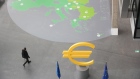 A Euro symbol sculpture at the European Central Bank (ECB) headquarters in Frankfurt, Germany, on Thursday, March 7, 2024. The European Central Bank left interest rates unchanged for a fourth meeting as a softer outlook for inflation and economic growth fed expectations for cuts to begin in June. Photographer: Alex Kraus/Bloomberg