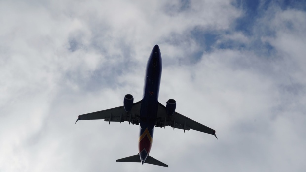 A Boeing 737 Next Generation (737NG) aircraft, operated by Southwest Airlines Co., flies into San Diego International Airport (SAN) in San Diego, California, U.S., on Monday, April 27, 2020. U.S. airlines reached preliminary deals to access billions of dollars in federal aid, securing a temporary lifeline as the industry waits for customers to start flying again. Photographer: Bing Guan/Bloomberg