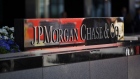 Pedestrians pass in front of the JPMorgan Chase & Co. headquarters in New York. Photographer: Scott Eells/Bloomberg