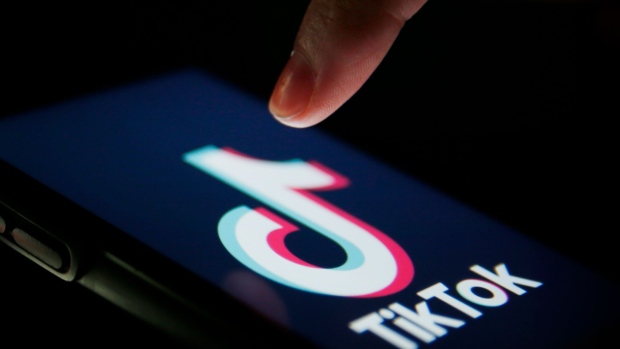 http://www.bnnbloomberg.ca/polopoly_fs/1.1500158!/fileimage/httpImage/image.jpg_gen/derivatives/landscape_620/the-tiktok-logo-is-displayed-on-a-smartphone-in-this-arranged-photograph-in-london-u-k-on-monday-aug-3-2020.jpg