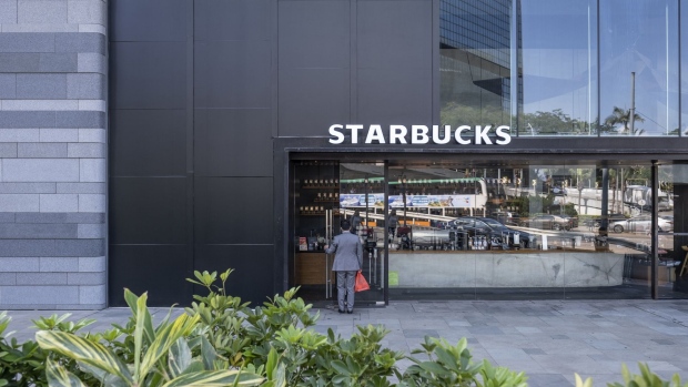http://www.bnnbloomberg.ca/polopoly_fs/1.1516322!/fileimage/httpImage/image.jpg_gen/derivatives/landscape_620/a-customer-enters-a-starbucks-corp-outlet-operated-by-maxim-s-caterers-ltd-in-the-admiralty-district-of-hong-kong-china-on-thursday-jan-23-2020-maxim-s-caterers-runs-more-than-1-300-eateries-mainly-in-hong-kong-and-macau-including-160-starbucks-coffee-shops.jpg