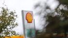 A Shell logo sits on a totem sign at a Royal Dutch Shell Plc petrol filling station in Cobham, U.K., on Wednesday, Sept. 30, 2020. Royal Dutch Shell Plc will cut as many as 9,000 jobs as Covid-19 accelerates a company-wide restructuring into low-carbon energy. Photographer: Chris Ratcliffe/Bloomberg