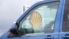 A Shell logo sits on a totem sign at a Royal Dutch Shell Plc petrol filling station in Ewell, U.K., on Wednesday, Sept. 30, 2020. Royal Dutch Shell Plc will cut as many as 9,000 jobs as Covid-19 accelerates a company-wide restructuring into low-carbon energy. Photographer: Chris Ratcliffe/Bloomberg