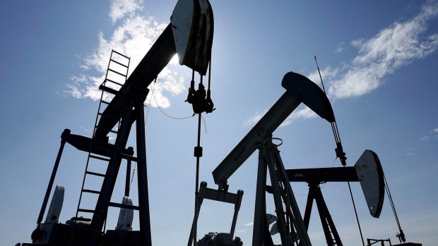 Oil gains as rosier demand outlook, weaker dollar boost prices