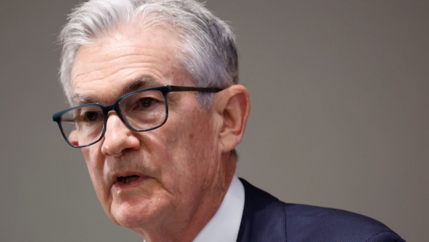 Fed's Powell notes inflation is easing but downplays discussion of interest rate cuts