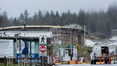<p>An entrance gate to a construction site at the Trans Mountain Pipeline expansion project at the Burnaby Terminal.</p>