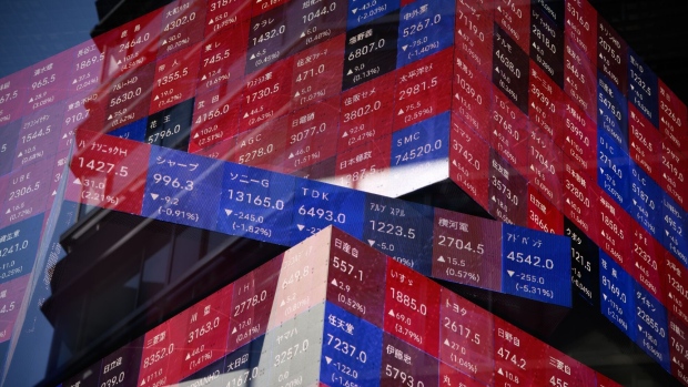 An electronic stock board displayed inside the Kabuto One building in Tokyo, Japan. Photographer: Akio Kon/Bloomberg