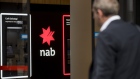 Signage outside a National Australia Bank Ltd. (NAB) branch in Sydney, Australia, on Friday, Aug. 5, 2022. Australia’s central bank lifted its inflation and wage growth forecasts while predicting unemployment will remain under 4% through mid-2024, underscoring the need for even tighter monetary policy. Photographer: Brent Lewin/Bloomberg