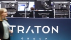 Traton SE branding sits on display as Volkwagen AG's truck unit makes its initial public offering (IPO) on the trading floor of the Frankfurt Stock Exchange, operated by Deutsche Boerse AG, in Frankfurt, Germany, on Friday, June 28, 2019. Volkswagen raised 1.55 billion euros ($1.8 billion) selling a stake in its trucks business, but only after pricing the offer at the low end of a target range to attract investors to one of Europe’s biggest initial public offerings this year. Photographer: Alex Kraus/Bloomberg