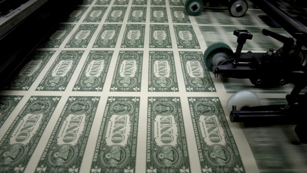 50 subject one dollar note sheets are run through an intaglio printing press before the face is printed at the U.S. Bureau of Engraving and Printing in Washington, D.C., U.S.