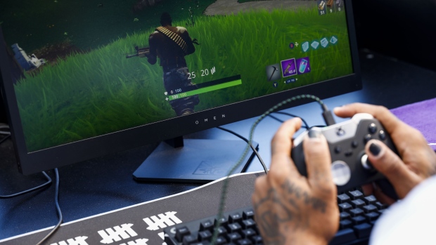 an attendee plays in the epic games inc fortnite battle royale celebrity pro am - how to play fortnite on mac without high sierra