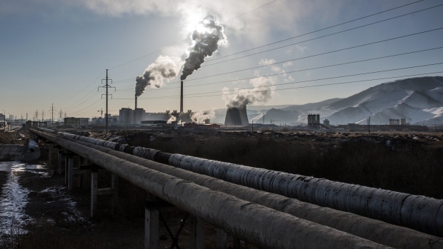 The sun rises over a ger district on the outskirts of Ulaanbaatar. Photographer: Taylor Weidman/Bloomberg