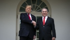 U.S. President Donald Trump speaks with Benjamin Netanyahu, Israel's prime minister, right, while standing for photographs in the Rose Garden of the White House in Washington, D.C., U.S., on Monday, March 25, 2019.