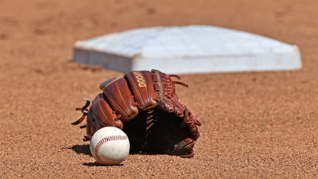 Omaha, NE - JUNE 24: A general view of a baseball and glove in the the field, prior to game one of the College World Series Championship Series between the Michigan Wolverines and Vanderbilt Commodores on June 24, 2019 at TD Ameritrade Park Omaha in Omaha, Nebraska. (Photo by Peter Aiken/Getty Images)