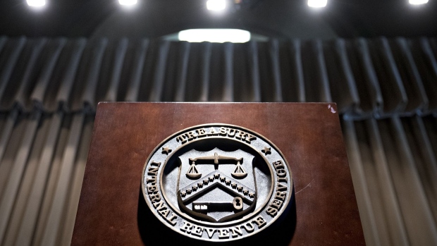 The seal of the Internal Revenue Service (IRS) hangs on a podium during an IRS Criminal Investigation 100th year anniversary event at the agency's headquarters in Washington, D.C., U.S., on Monday, July 1, 2019. On July 1, 1919, the IRS commissioner crated the Intelligence Unit to investigate widespread allegations of tax fraud. 