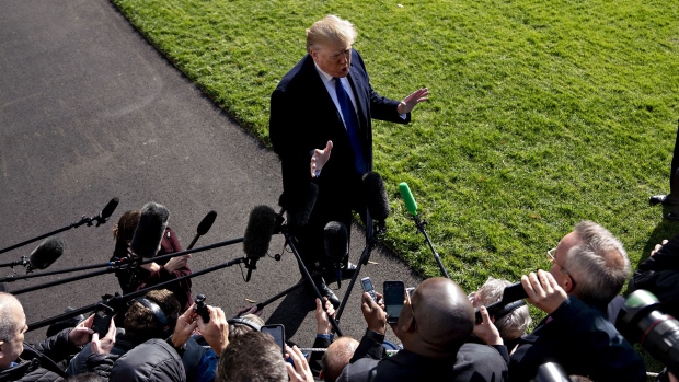 Donald Trump speaks to members of the media before boarding Marine One on the South Lawn of the White House in Washington, D.C. Photographer: Andrew Harrer/Bloomberg