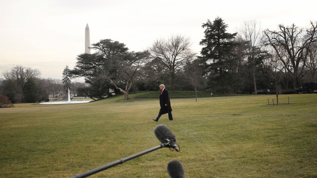 Donald Trump walks on the South Lawn of the White House before boarding Marine One in Washington, D.C. Photographer: Andrew Harrer/Bloomberg
