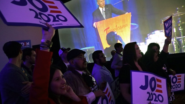 LAS VEGAS, NEVADA - FEBRUARY 15: Supporters hold signs as Democratic presidential candidate former Vice President Joe Biden speaks during the Clark County Democrats Kick Off to Caucus Gala at Tropicana Las Vegas February 15, 2020 in Las Vegas, Nevada. The first time in the history, Nevadans have the option to vote early in the Democratic presidential caucuses that starts from today through the 18th, prior to the February 22nd caucus date. (Photo by Alex Wong/Getty Images)