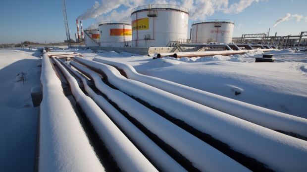 Oil pipelines and storage tanks stand in the snow at the Novokuibyshevsk oil storage plant, operated by Rosneft PJSC, in Novokuibyshevsk, Samara region, Russia, on Thursday, Dec. 22, 2016.