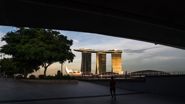 The Marina Bay Sands hotel and casino stands at dusk during the "circuit breaker" lockdown in Singapore on May 20. Photographer: Lauryn Ishak/Bloomberg