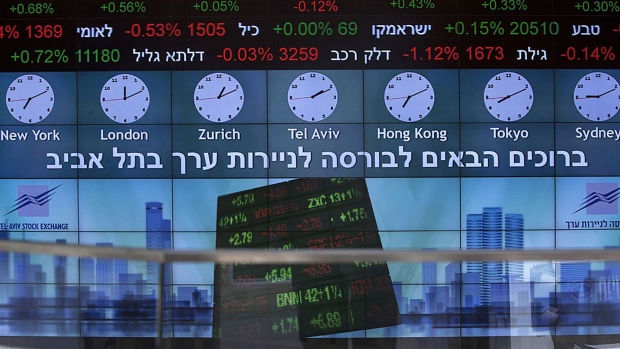 A stock market ticker displays financial information and world time zones in the lobby of the Tel Aviv Stock Exchange (TASE) in Tel Aviv, Israel, on Thursday, Aug. 4, 2016. As part of a planned overhaul to keep the bourse alive and relevant to its robust high tech-based economy, the Tel Aviv Stock Exchange plans to join most of the world on a Monday-to-Friday schedule to lure foreign traders, after 63 years of being open Sunday-to-Thursday.