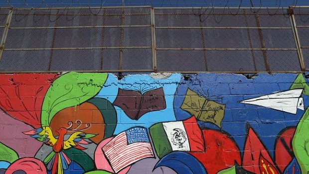 TIJUANA, MEXICO - SEPTEMBER 24: A mural stands painted on the Mexican side of the U.S.-Mexico border wall on September 24, 2016 in Tijuana, Mexico. Securing the border and controlling illegal immigration have become key issues in the U.S. Presidential campaign. (Photo by John Moore/Getty Images)