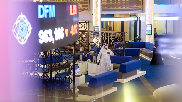 Investors visit the Dubai Financial Market PJSC (DFM) in Dubai, United Arab Emirates, on Sunday, Sept. 6, 2020. Dubai made a rare foray into public bond markets, revealing along the way that its debt burden is now a lot smaller than estimated by analysts only months ago. Photographer: Christopher Pike/Bloomberg