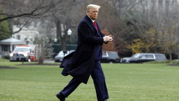 U.S. President Donald Trump walks before boarding Marine One on the South Lawn of the White House in Washington, D.C., U.S., on Saturday, Dec. 12, 2020. Trump will attend the 121st Army-Navy Football Game at the United States Military Academy in West Point.