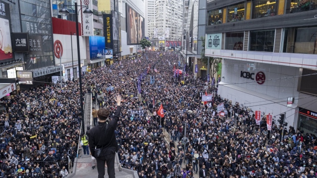 Demonstrators march in the Causeway Bay district of Hong Kong on Jan. 1, 2020. Photographer: Justin Chin/Bloomberg