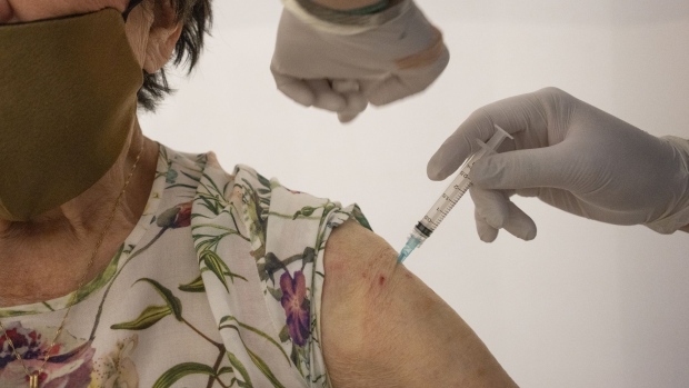 A healthcare worker administers a dose of the Sinovac Biotech Ltd. coronavirus vaccine during a vaccination event at the Cesfam Ignacio Domeyko health center in Santiago, Chile, on Wednesday, Feb. 3, 2021. Chile, the second Latin American country to use the Sinovac vaccine, will begin vaccinating the elderly with newly arrived shots after an initial 67,000 inoculations given to health workers.