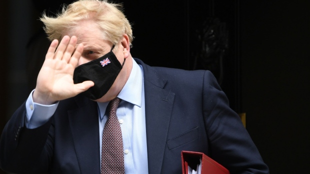 Boris Johnson, U.K. prime minister, departs number 10 Downing Street on his way to attend a weekly questions and answers session in Parliament in London, U.K., on Wednesday, May 26, 2021. Johnson is braced for an onslaught of criticism from his former adviser Dominic Cummings, who is set to reveal what he knows about government missteps that contributed to the U.K. suffering the worst pandemic death toll in Europe.