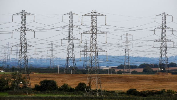 Power lines run from Hinkley Point nuclear power stations, operated by Electricite de France SA's (EDF), near Bridgwater, U.K., on Thursday, Sept. 15, 2016. After a decade of dealmaking and political brinkmanship, Electricite de France SA finally won the green light to build what will be the most expensive nuclear power station ever built, an 18 billion-pound ($24 billion) behemoth at Hinkley Point on England's west coast. Photographer: Luke MacGregor/Bloomberg