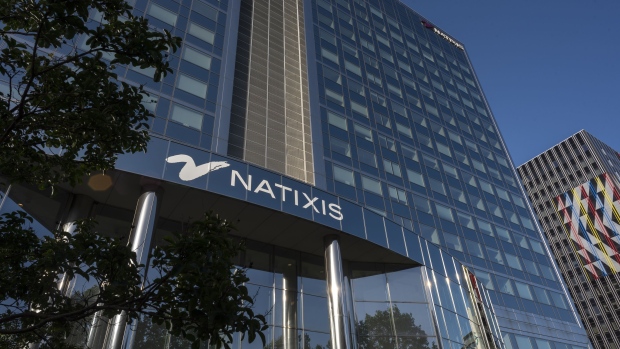 The Natixis SA logo sits on the company's offices in Paris, France, on Saturday, June 29, 2019. The latest turmoil in European finance is swirling around H2O Asset Management, a London-based firm that boomed since its founding almost a decade ago with the backing of French investment bank Natixis. Photographer: Martin Barzilai/Bloomberg