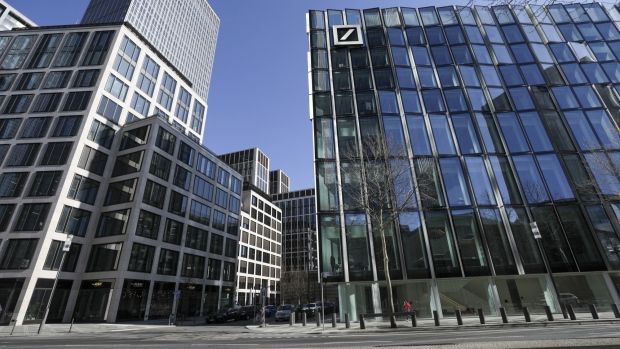 A pedestrian passes the DWS Group office, the asset-management unit of Deutsche Bank AG, as nationwide coronavirus crackdown measures are extended, in Frankfurt, Germany, on Monday, March 23, 2020. Germany signed off on taking on billions in new debt as part of an unprecedented package totaling more than 750 billion euros ($800 billion) to cushion the fallout from the coronavirus pandemic.
