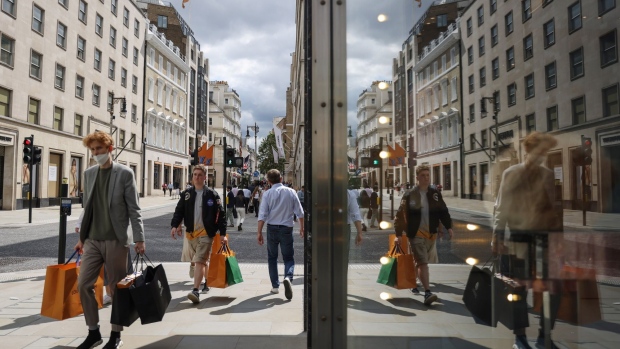 Shoppers walk along New Bond Street in London, U.K., on Wednesday, Aug. 18, 2021. U.K. inflation eased in July in what is widely seen as a blip on its way to double the Bank of England’s target this year. Photographer: Hollie Adams/Bloomberg