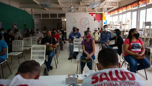 Patient sits in a waiting room after receiving their first dose of the Cuban Abdala Covid-19 vaccine in the Ciudad Tiuna neighborhood of Caracas, on July 1, 2021. Photographer: Gaby Oraa/Bloomberg