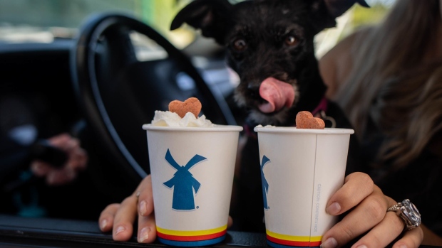 A customer receives dog treat drinks at the drive-through window of a Dutch Bros. Photographer: Maranie Staab/Bloomberg