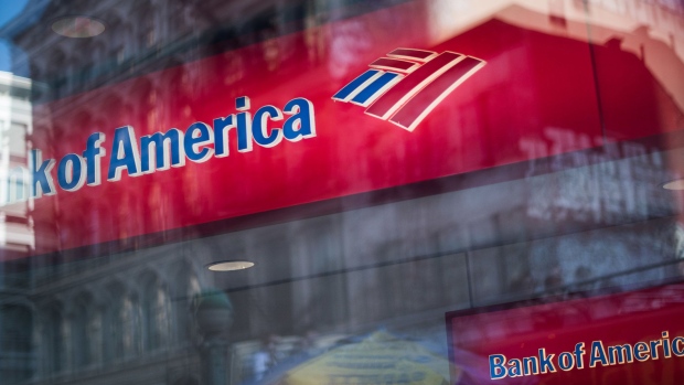 Bank of America Corp. signage is seen with street reflections on a window in New York, U.S.