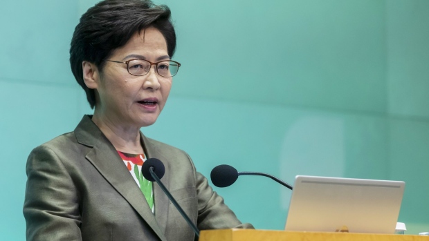Carrie Lam, Hong Kong's chief executive, speaks during a news conference in Hong Kong, China, on Wednesday, Oct. 6, 2021. In the last annual policy address of her current term, Lam announced plans to transform the northern part of the New Territories -- relatively underdeveloped compared to Hong Kong Island and Kowloon -- into the next residential and commercial hub spanning 300 square kilometers (116 square miles).
