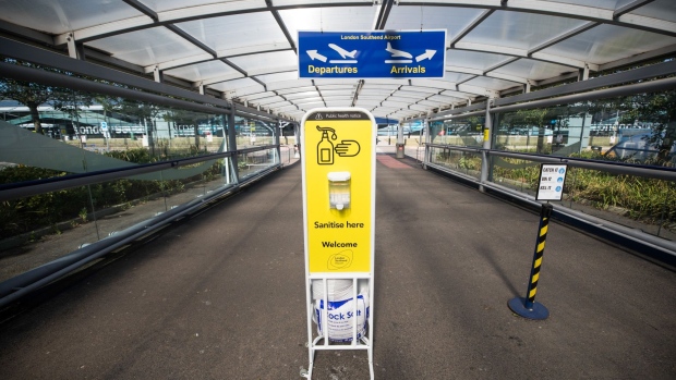 A hand sanitizing station stands at the exit to Southend Airport railway station at London Southend Airport, part of the Stobart Group Ltd., in Southend-on-Sea, U.K., on Tuesday, July 7, 2020. EasyJet Plc plans to shutdown bases in Stansted, Southend and Newcastle in the U.K. Photographer: Chris Ratcliffe/Bloomberg