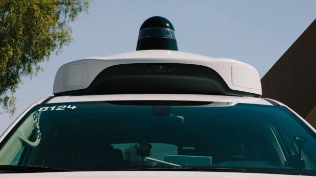 A camera sensor sits on the roof of a Waymo LLC Chrysler Pacifica autonomous vehicle in Chandler, Arizona, U.S., on Monday, July 30, 2018. The Google offshoot is tinkering with pricing and finalizing its business model for autonomous vehicles, which includes a new effort to boost public transit. Photographer: Caitlin O'Hara/Bloomberg