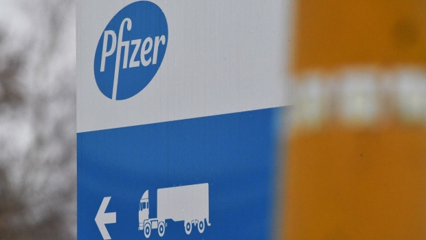 A haulage truck symbol and Pfizer Inc. logo at the drug maker's production facility in Puurs, Belgium, on Thursday, Dec. 3, 2020. The quick approval of Pfizer Inc.’s coronavirus vaccine in the U.K. isn’t likely to accelerate the availability of the shot in Asia, as countries work to complete local safety tests and negotiate deals. Photographer: Geert Vanden Wijngaert/Bloomberg