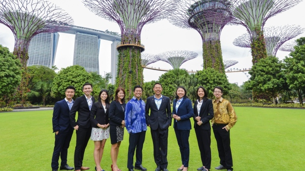 Yinglan Tan, fourth from right, with his team in Singapore. Source: Jacky_Ng/Bloomberg