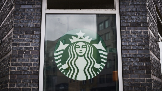 Signage is displayed at a temporarily closed Starbucks coffee shop in the Brooklyn borough of New York, U.S., on Monday, April 27, 2020. Starbucks Corp. is scheduled to release earnings figures on April 28. Photographer: Gabby Jones/Bloomberg