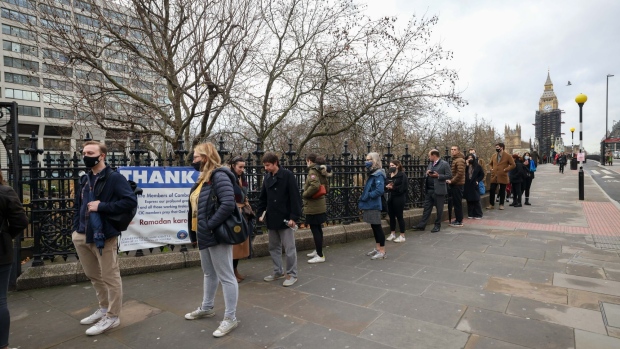 Visitors queue for Covid-19 vaccinations at St. Thomas' Hospital in London. Photographer: Chris Ratcliffe/Bloomberg
