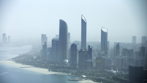 Residential and commercial skyscrapers stand along the coastline in Abu Dhabi, United Arab Emirates, on Tuesday, April 10, 2018. Abu Dhabi National Oil Co. will issue its first competitive tender for partners to explore for and develop oil and natural gas as the government-owned producer seeks new ways to increase production in the United Arab Emirates.
